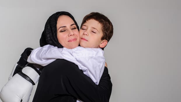 mom hugging son